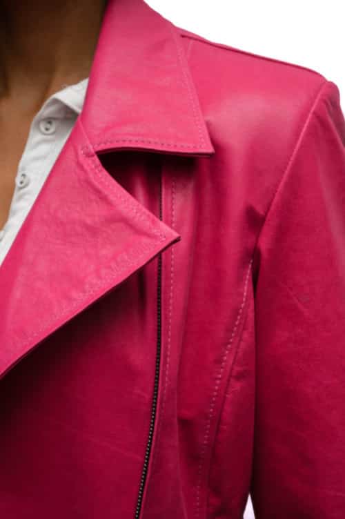 An image of a product sold on ebay of a pink leather jacket with a white background.